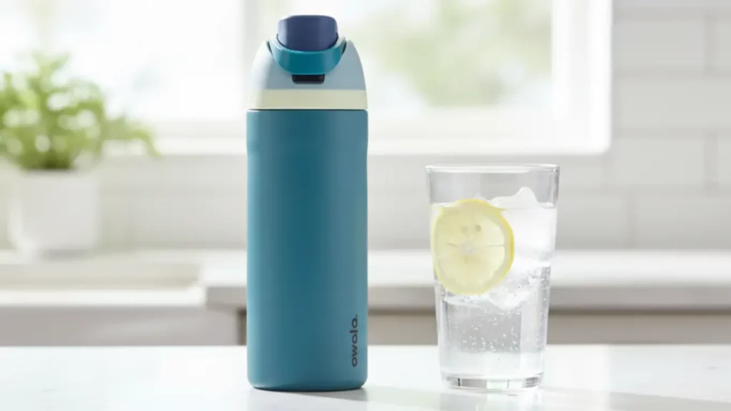 High-quality insulated water bottle on sunny counter, essential hydration gift for pregnant best friend to keep water cold.